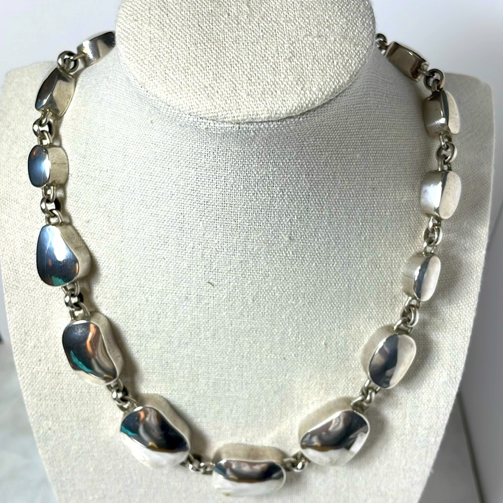 Graduated flat bead, chunky sterling silver necklace.